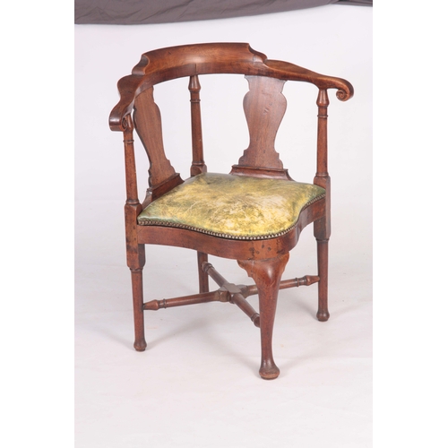 1334 - A MID 18TH CENTURY WALNUT CORNER CHAIR with vase shaped back splats, scrolled arms and turned suppor... 