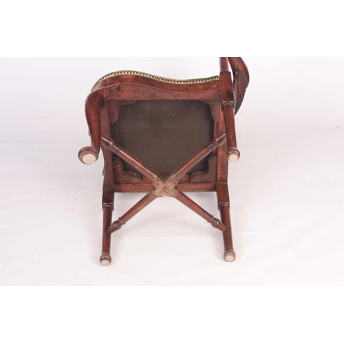 1334 - A MID 18TH CENTURY WALNUT CORNER CHAIR with vase shaped back splats, scrolled arms and turned suppor... 