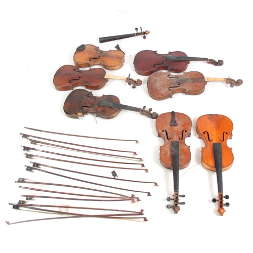 779 - A COLLECTION OF 7 VIOLINS AND 13 VIOLIN BOWS including a labelled Breton Brevete, length of back 35.... 