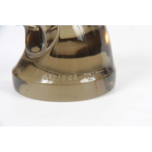 19 - RENE LALIQUE. AN EARLY 20th CENTURY TOPAZ TELE D'EPERVIER CAR MASCOT modelled as a hawks head, raise... 