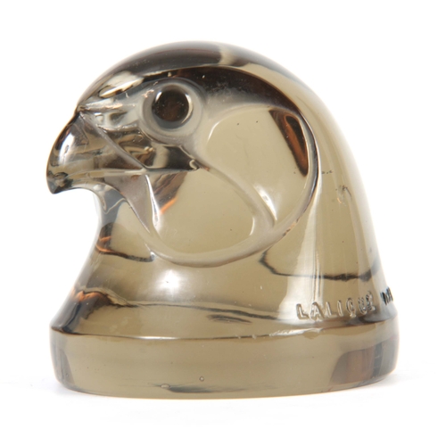 19 - RENE LALIQUE. AN EARLY 20th CENTURY TOPAZ TELE D'EPERVIER CAR MASCOT modelled as a hawks head, raise... 