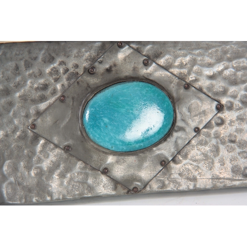 462 - AN ARTS AND CRAFTS BEATEN PEWTER PHOTOGRAPH FRAME set with a blue Ruskin style large oval ceramic me... 