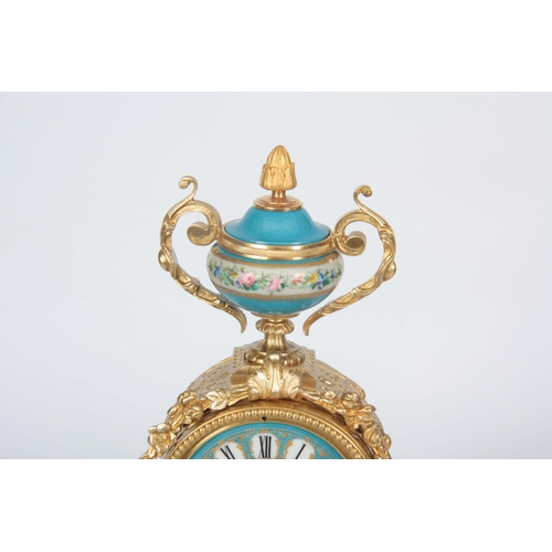 565 - A LATE 19TH CENTURY FRENCH ORMOLU AND PORCELAIN PANELLED MANTEL CLOCK the case surmounted by a flora... 