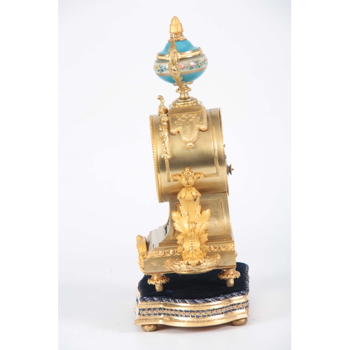 565 - A LATE 19TH CENTURY FRENCH ORMOLU AND PORCELAIN PANELLED MANTEL CLOCK the case surmounted by a flora... 