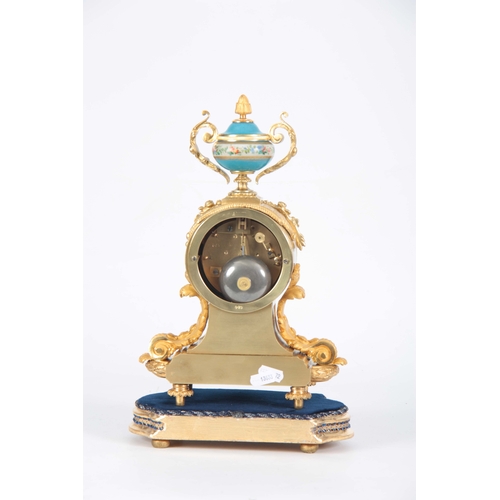 565 - A LATE 19TH CENTURY FRENCH ORMOLU AND PORCELAIN PANELLED MANTEL CLOCK the case surmounted by a flora... 