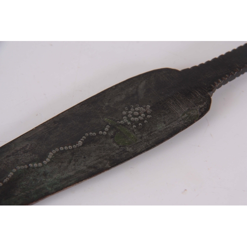 306 - AN EARLY ROMAN / MEDIEVAL BRONZE SPEARHEAD with punched decoration 30.5cm overall.