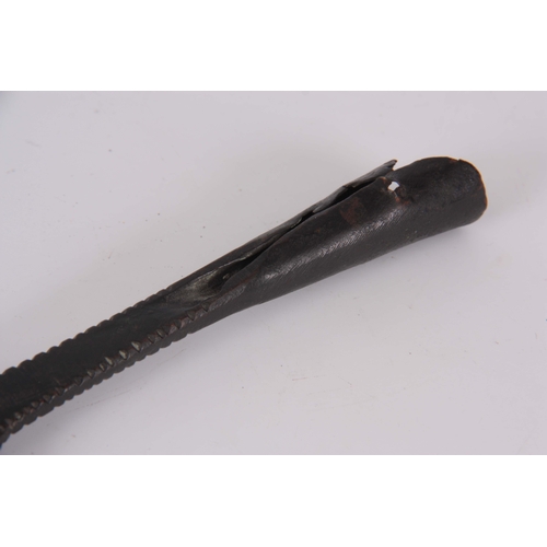 306 - AN EARLY ROMAN / MEDIEVAL BRONZE SPEARHEAD with punched decoration 30.5cm overall.