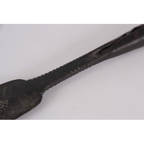 306 - AN EARLY ROMAN / MEDIEVAL BRONZE SPEARHEAD with punched decoration 30.5cm overall.