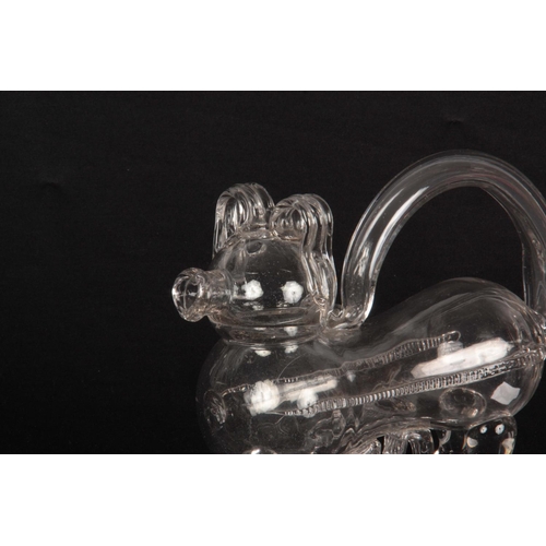 6 - AN UNUSUAL 19TH/20TH CENTURY CLEAR GLASS DECANTER modelled as a dog, 23cm across 18cm high