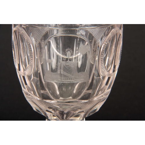 8 - A 19TH CENTURY EUROPEAN GLASS GOBLET with petal-shaped star cut base on a hexagonal stem and facette... 
