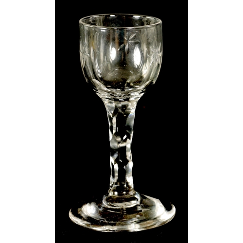 1 - A GEORGIAN SHORT WINE GLASS the slightly rounded bowl with star-cut decoration on a faceted stem and... 