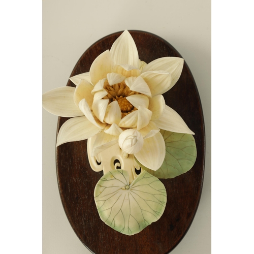 110 - A GARNITURE OF THREE LATE 19TH CENTURY COLOURED STAINED IVORY FLOWER SPRAY SCULPTURES depicting chry... 