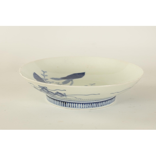 112 - A JAPANESE EDO PERIOD BLUE AND WHITE PORCELAIN DISH with lily spray decoration (20.5cm diameter )