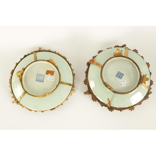 117 - A PAIR OF 19TH CENTURY CHINESE CANTON FAMILLE VERTE DISHES with floral, bird and butterfly decoratio... 