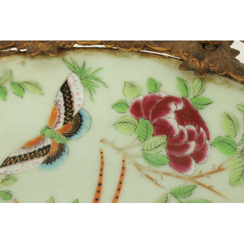 117 - A PAIR OF 19TH CENTURY CHINESE CANTON FAMILLE VERTE DISHES with floral, bird and butterfly decoratio... 