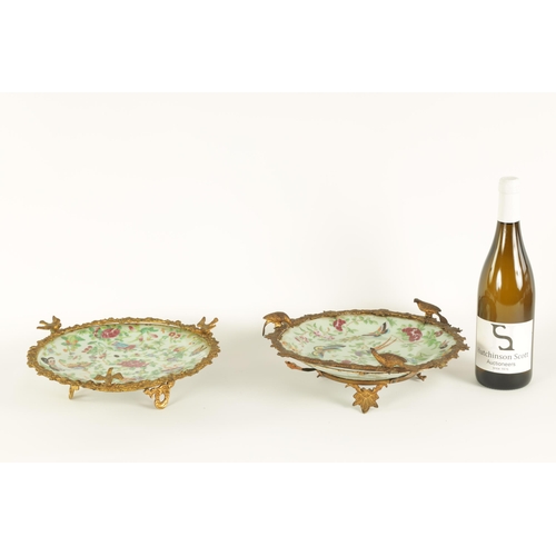 117 - A PAIR OF 19TH CENTURY CHINESE CANTON FAMILLE VERTE DISHES with floral, bird and butterfly decoratio... 