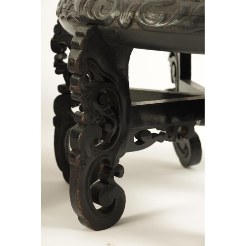 118 - A PAIR OF 19TH CENTURY CHINESE CARVED EBONISED HARDWOOD VASE STANDS the recessed circular tops with ... 