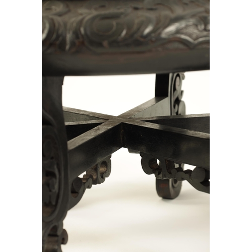 118 - A PAIR OF 19TH CENTURY CHINESE CARVED EBONISED HARDWOOD VASE STANDS the recessed circular tops with ... 