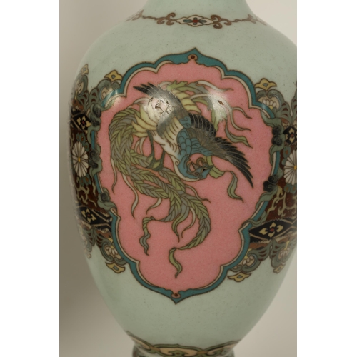 122 - A PAIR OF MEIJI PERIOD JAPANESE CLOISONNE VASES of footed baluster form with oval pink panels of exo... 