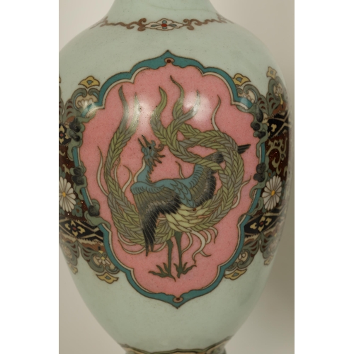 122 - A PAIR OF MEIJI PERIOD JAPANESE CLOISONNE VASES of footed baluster form with oval pink panels of exo... 