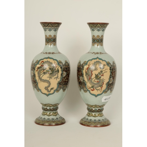 122 - A PAIR OF MEIJI PERIOD JAPANESE CLOISONNE VASES of footed baluster form with oval pink panels of exo... 