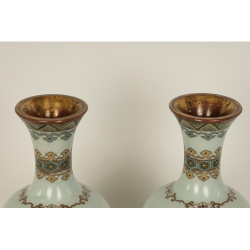 122 - A PAIR OF MEIJI PERIOD JAPANESE CLOISONNE VASES of footed baluster form with oval pink panels of exo... 