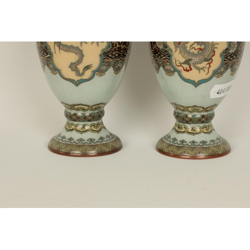 122 - A PAIR OF MEIJI PERIOD JAPANESE CLOISONNE VASES of footed baluster form with oval pink panels of exo... 