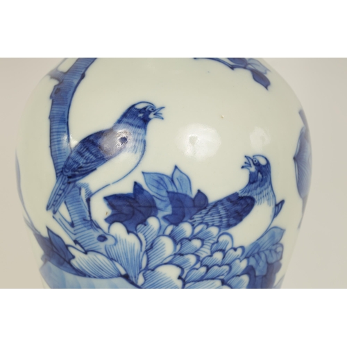 126 - AN 18TH/19TH CENTURY CHINESE BLUE AND WHITE VASE of slender baluster form decorated with birds among... 