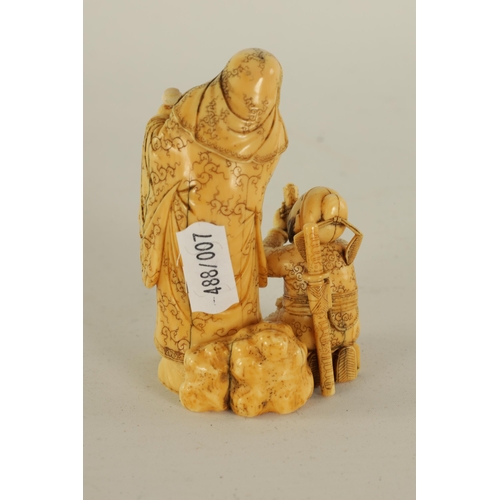 129 - AN EARLY 19TH CENTURY CARVED IVORY FIGURE GROUP depicting two elder scholars one stood with staff th... 