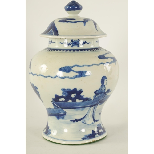 130 - AN EARLY 19TH CENTURY CHINESE BLUE AND WHITE BALUSTER VASE AND COVER decorated with figures in a gar... 