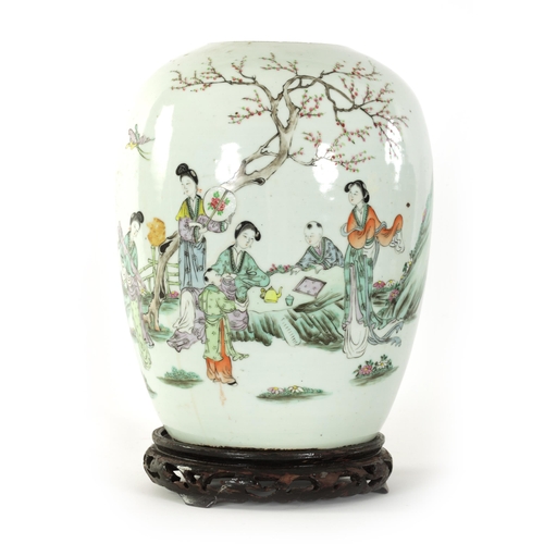 131 - AN EARLY 19TH CENTURY CHINESE FAMILLE VERTE GINGER JAR decorated with figures in a garden setting, r... 