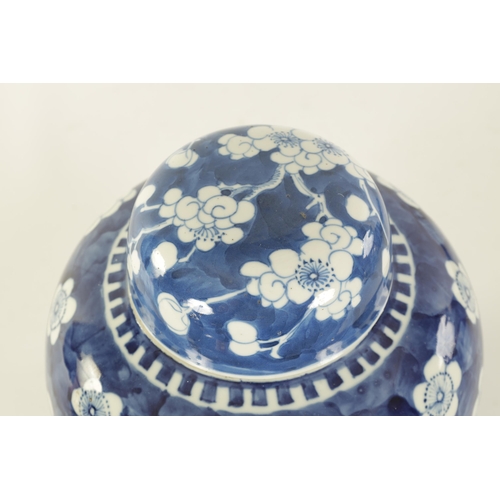 132 - AN EARLY 19TH CENTURY CHINESE LARGE BLUE AND WHITE GINGER JAR AND COVER with prunus blossom decorati... 