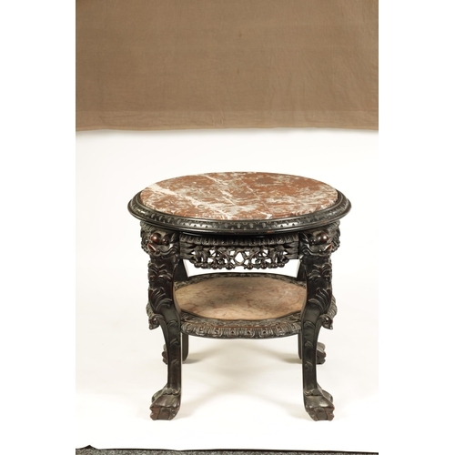 139 - A 19TH CENTURY CHINESE HARDWOOD JARDINIERE STAND with circular marble top above a carved pierced fri... 