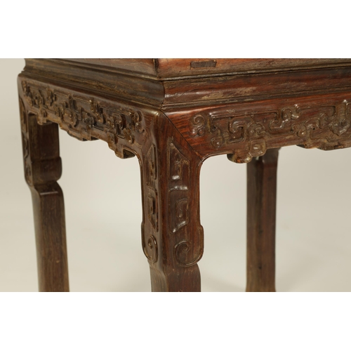 140 - A 19TH CENTURY CHINESE HARDWOOD SQUARE OCCASIONAL TABLE with panelled top joined by carved rails, st... 