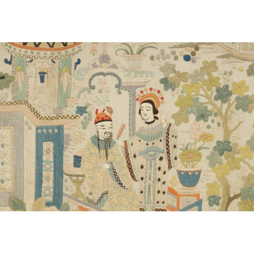 144 - A FINE 19TH CENTURY CHINESE EMBROIDERED SILK PANEL decorated with figures in a garden setting with f... 