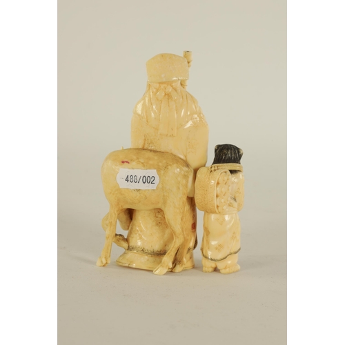 145 - A FINELY CARVED CHINESE IVORY SCULPTURE depicting a sage with a young child and a deer - signed to t... 