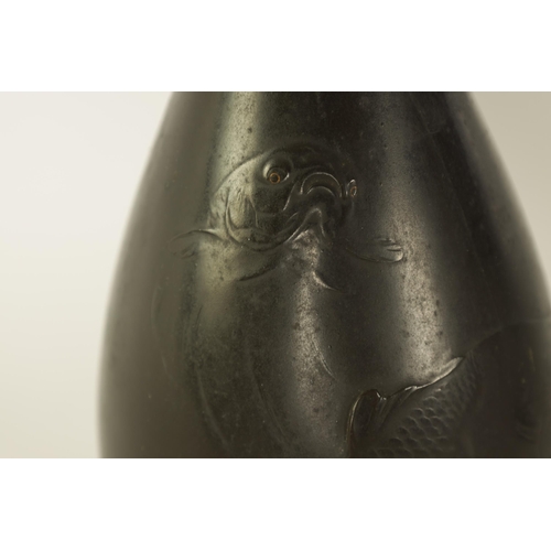 146 - A JAPANESE MEIJI PERIOD BOTTLENECK VASE decorated fish with gilt inset eyes - signed beneath (26cm h... 