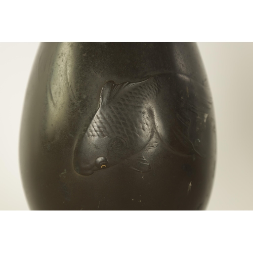 146 - A JAPANESE MEIJI PERIOD BOTTLENECK VASE decorated fish with gilt inset eyes - signed beneath (26cm h... 