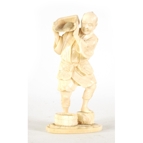 147 - A JAPANESE MEIJI PERIOD CARVED IVORY FIGURE depicting a farmer pouring grain. (14cm high )