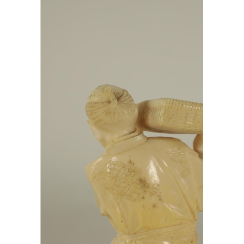 147 - A JAPANESE MEIJI PERIOD CARVED IVORY FIGURE depicting a farmer pouring grain. (14cm high )