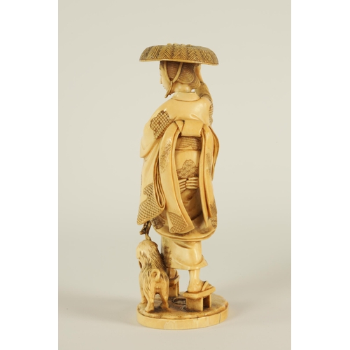 148 - A JAPANESE MEIJI PERIOD CARVED IVORY OKIMONO finely carved depiciting a lady and gentleman with dog ... 