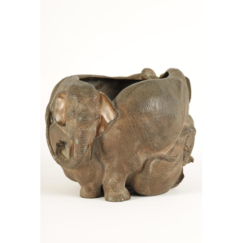 149 - A JAPANESE MEIJI PERIOD CAST BRONZE JARDINIERE MODELLED AS A FAMILY OF ELEPHANTS of entwined form (2... 