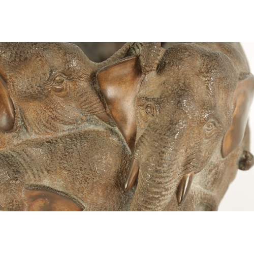 149 - A JAPANESE MEIJI PERIOD CAST BRONZE JARDINIERE MODELLED AS A FAMILY OF ELEPHANTS of entwined form (2... 