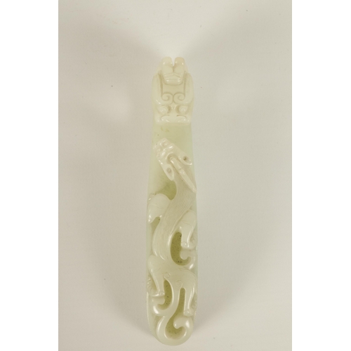 150 - A LARGE 18TH/19TH CENTURY CARVED WHITE JADE BELT HOOK the top carved in openwork and undercut with a... 