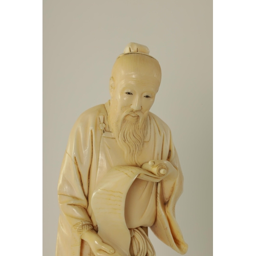 156 - A 19TH CENTURY CHINESE CARVED IVORY FIGURE depicting a scholar with a scroll - signed beneath. (22cm... 