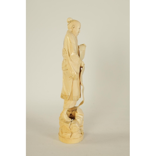 156 - A 19TH CENTURY CHINESE CARVED IVORY FIGURE depicting a scholar with a scroll - signed beneath. (22cm... 