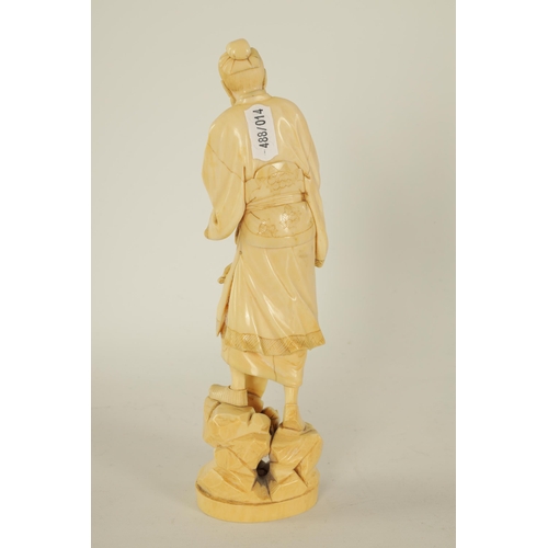 156 - A 19TH CENTURY CHINESE CARVED IVORY FIGURE depicting a scholar with a scroll - signed beneath. (22cm... 