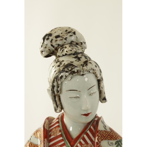 162 - A MATCHED PAIR OF 18TH/19TH CENTURY JAPANESE PORCELAIN GEISHAS finely modelled and decorated in colo... 