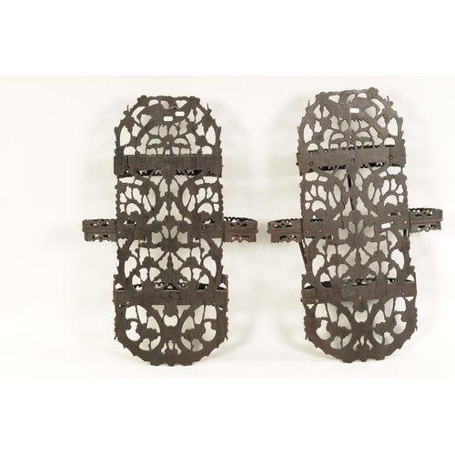 164 - A PAIR OF 19TH CENTURY CHINESE CARVED HARDWOOD HANGING SHELVES with pierced floral branchwork and bi... 