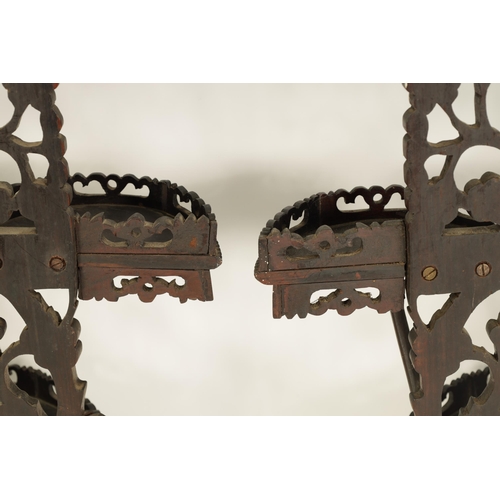 164 - A PAIR OF 19TH CENTURY CHINESE CARVED HARDWOOD HANGING SHELVES with pierced floral branchwork and bi... 